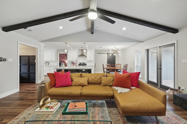 living room with visible vents, baseboards, lofted ceiling with beams, dark wood-type flooring, and recessed lighting