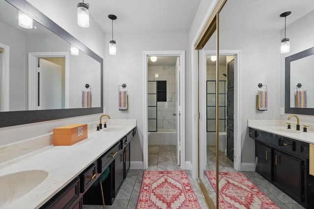 full bathroom featuring a sink, baseboards, and double vanity