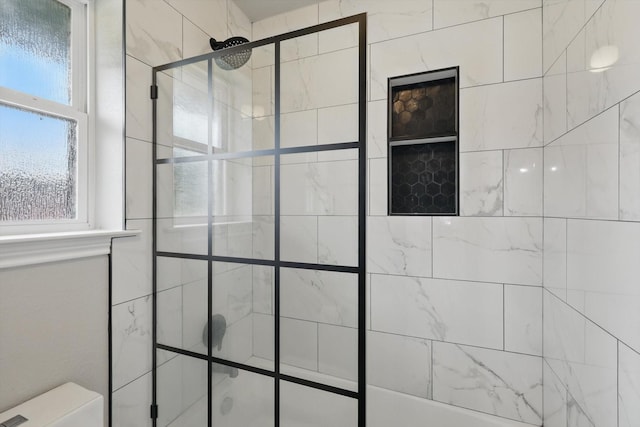 full bathroom with tiled shower