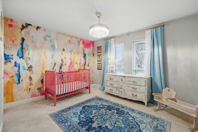 bedroom featuring baseboards, wallpapered walls, carpet floors, and a notable chandelier