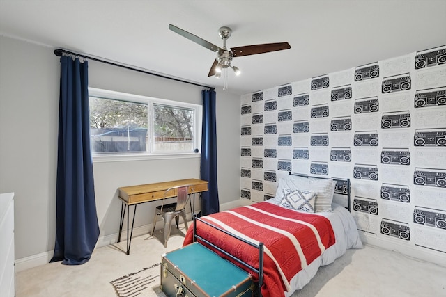 carpeted bedroom featuring ceiling fan and baseboards