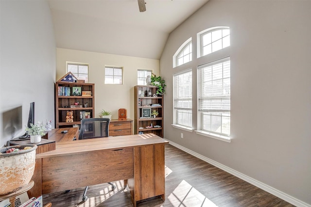 office with a ceiling fan, lofted ceiling, dark wood finished floors, and baseboards