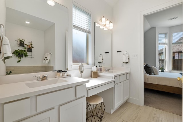 full bath with visible vents, ensuite bath, and vanity