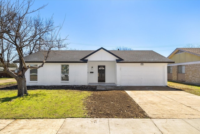 view of front of property featuring a garage, a shingled roof, concrete driveway, a front yard, and brick siding