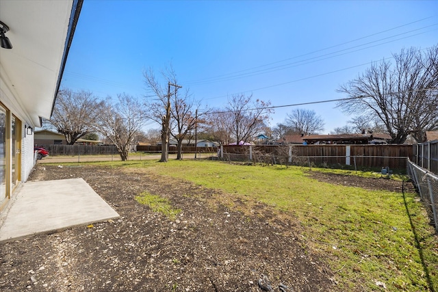 view of yard featuring a patio and a fenced backyard