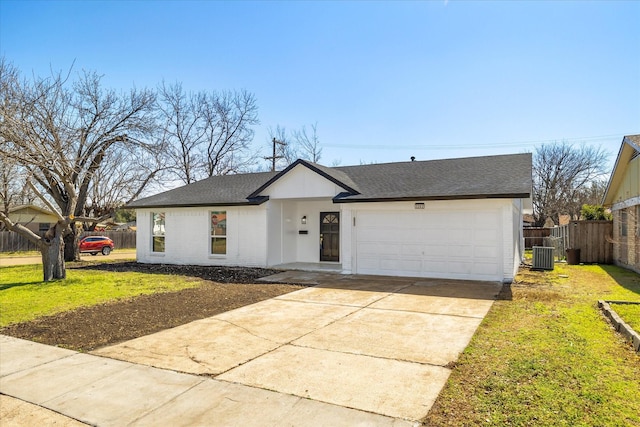 ranch-style home featuring concrete driveway, an attached garage, fence, cooling unit, and a front lawn