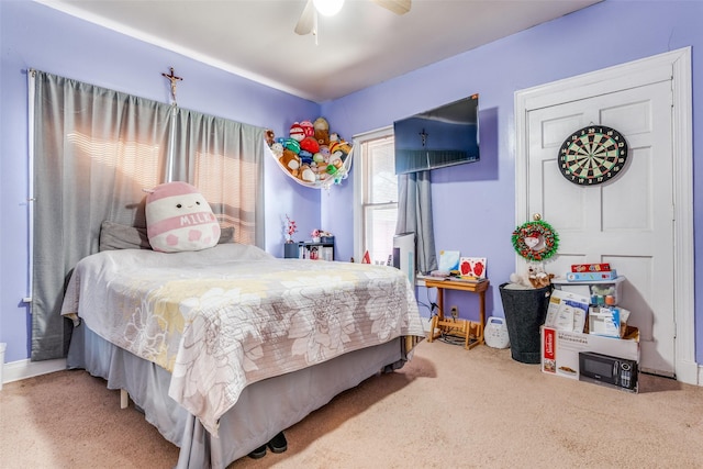 carpeted bedroom with ceiling fan