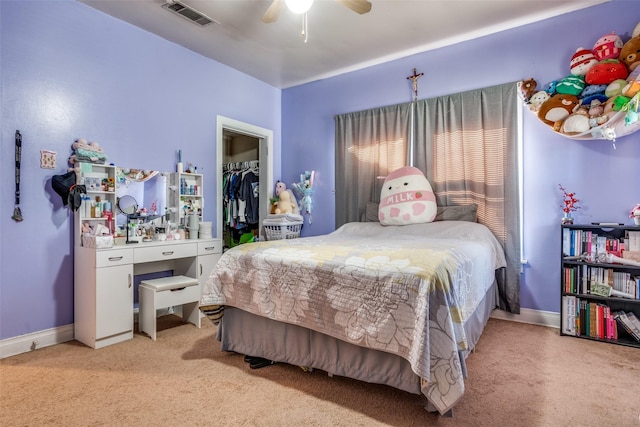 bedroom with light carpet, a closet, visible vents, and baseboards