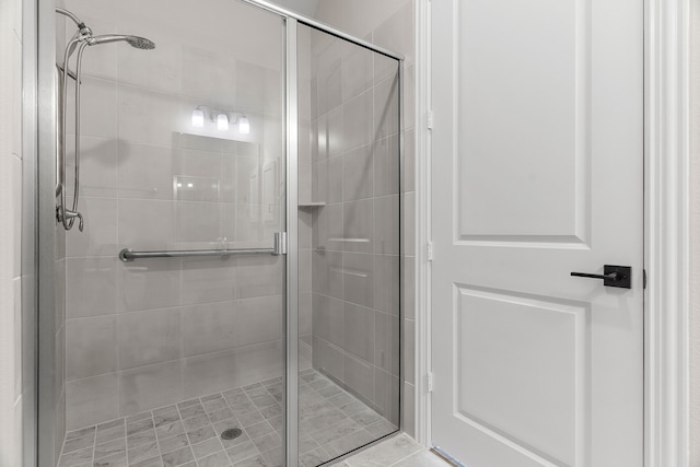 full bath with a shower stall