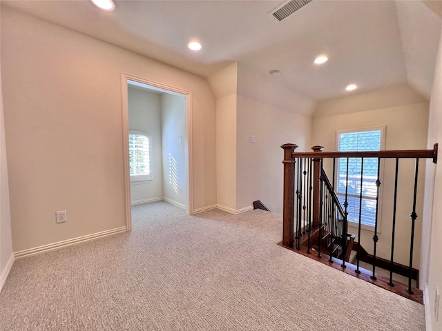 corridor with recessed lighting, visible vents, baseboards, an upstairs landing, and carpet