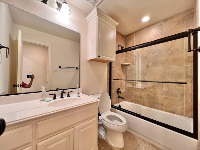 full bathroom featuring enclosed tub / shower combo, tile patterned flooring, toilet, recessed lighting, and vanity