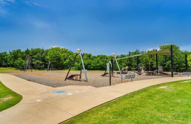 community jungle gym featuring a yard