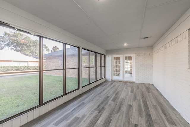 unfurnished sunroom with visible vents