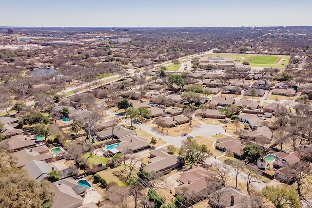 birds eye view of property with a residential view