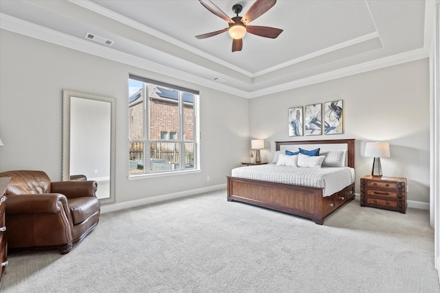 bedroom with carpet, visible vents, a raised ceiling, and baseboards