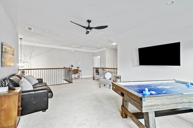 rec room featuring carpet, visible vents, ceiling fan, and baseboards