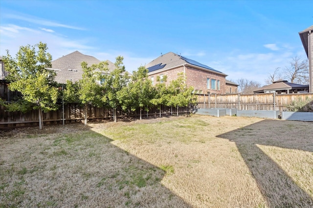 view of yard featuring a fenced backyard