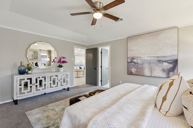 carpeted bedroom featuring baseboards, visible vents, and a ceiling fan