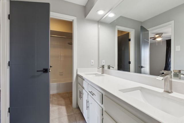 bathroom featuring double vanity, tile patterned flooring, shower / tub combination, and a sink