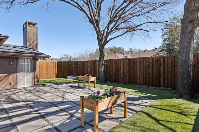 view of patio featuring a fenced backyard