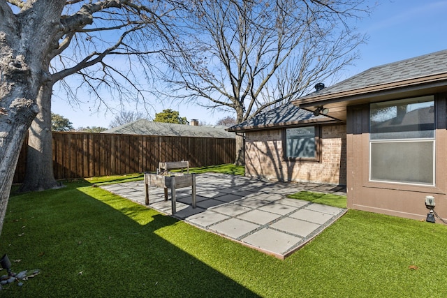 view of yard featuring a patio and fence