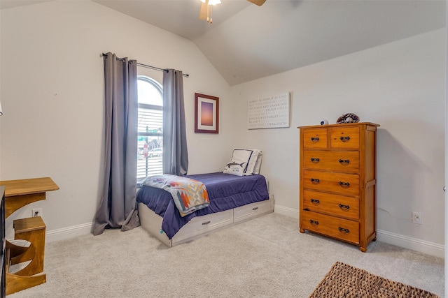 carpeted bedroom with lofted ceiling, ceiling fan, and baseboards