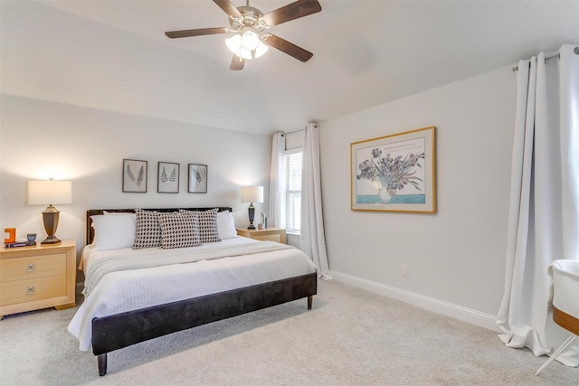 bedroom with vaulted ceiling, carpet flooring, a ceiling fan, and baseboards