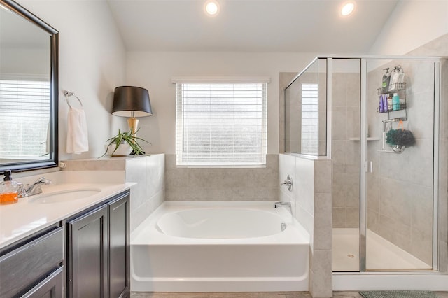 full bath with recessed lighting, a garden tub, a shower stall, and vanity