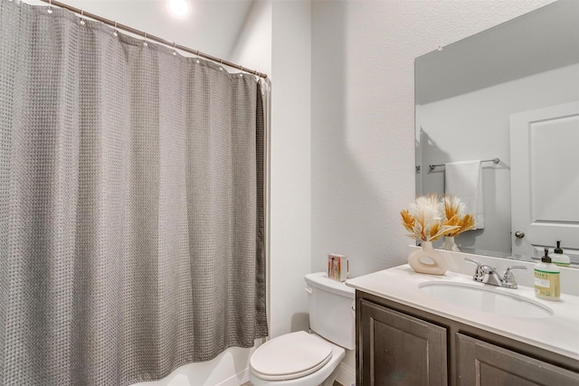 full bath featuring shower / bath combination with curtain, vanity, and toilet