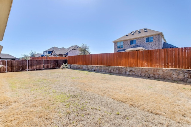 view of yard featuring a fenced backyard