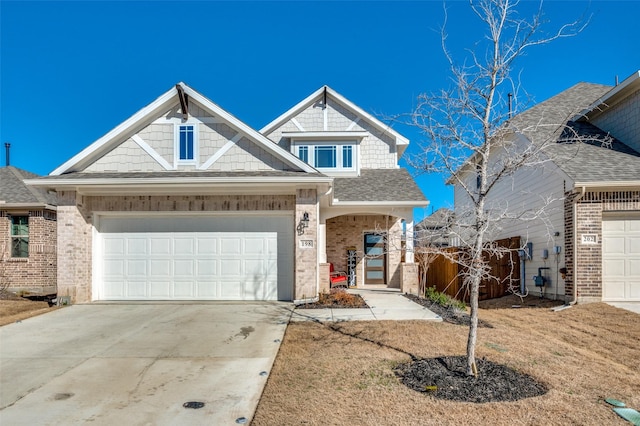 198 Fairmont Dr, Princeton, TX 75407 - view of front facade with brick siding, driveway, an attached garage, and roof with shingles