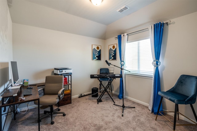 home office featuring carpet floors, baseboards, visible vents, and vaulted ceiling