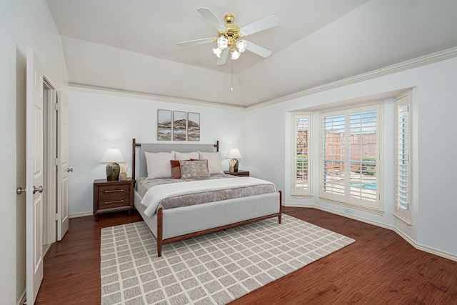 bedroom with light wood-type flooring, baseboards, ceiling fan, and a tray ceiling