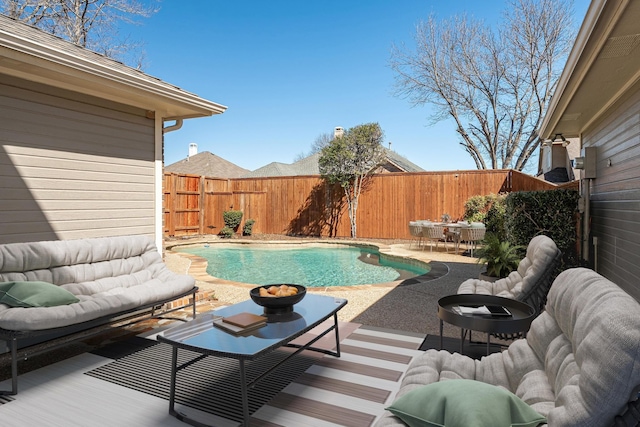 view of swimming pool with a patio area, a fenced backyard, and a fenced in pool