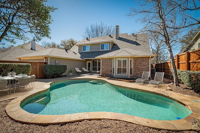 view of pool featuring a fenced backyard, a fenced in pool, and a patio