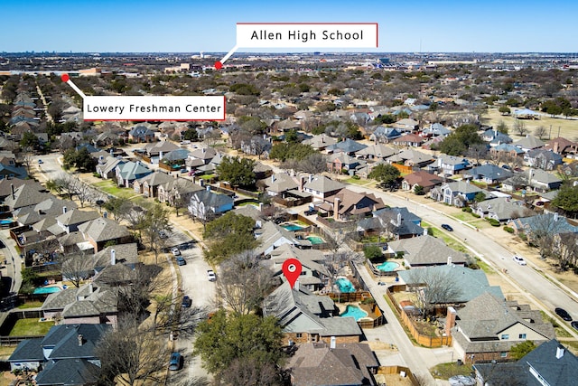 birds eye view of property with a residential view