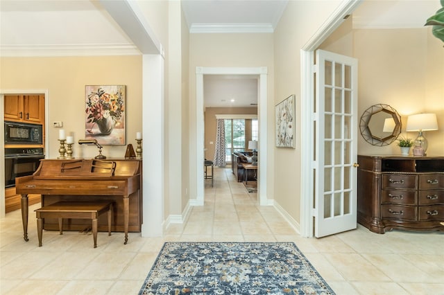 corridor with crown molding, baseboards, and light tile patterned floors