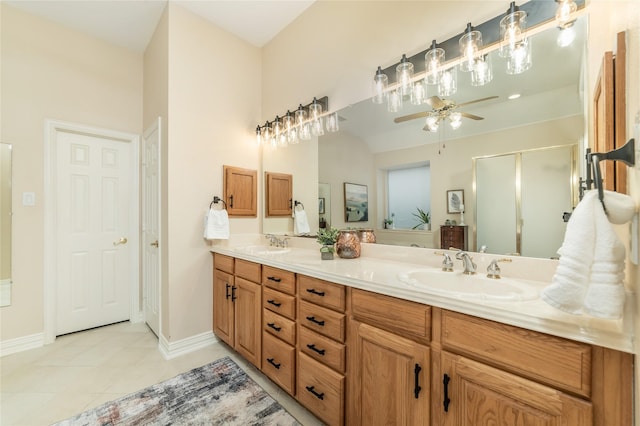 full bathroom with double vanity, a stall shower, tile patterned flooring, and a sink