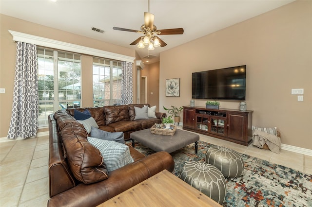 living room with light tile patterned floors, baseboards, visible vents, and a ceiling fan