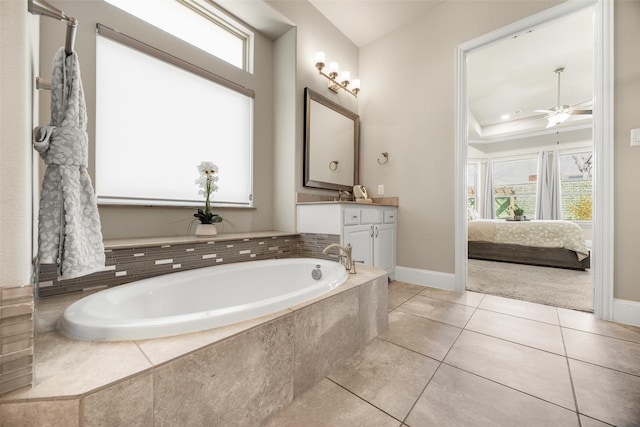 bathroom featuring a garden tub, ceiling fan, vanity, ensuite bath, and tile patterned flooring