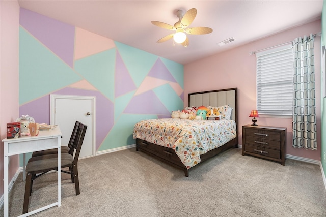 bedroom with baseboards, carpet flooring, visible vents, and a ceiling fan