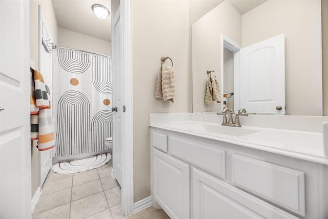 full bath with toilet, tile patterned floors, a shower with curtain, and vanity