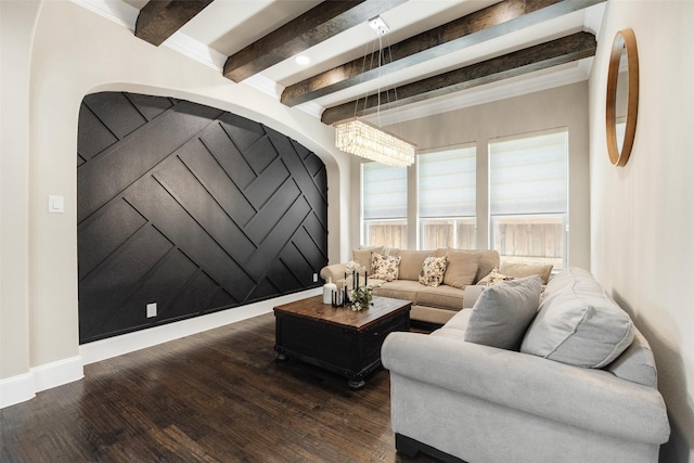 living room with dark wood-style floors, arched walkways, beamed ceiling, and baseboards