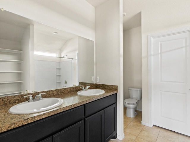 bathroom featuring a shower, tile patterned flooring, a sink, and toilet