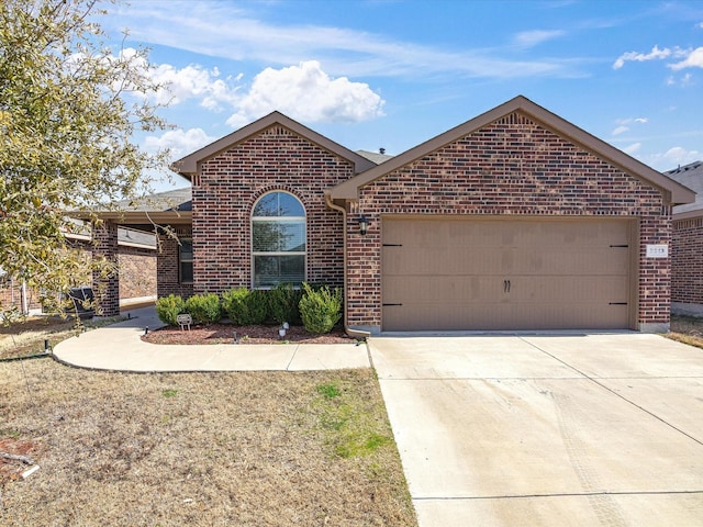 ranch-style house with an attached garage, concrete driveway, and brick siding