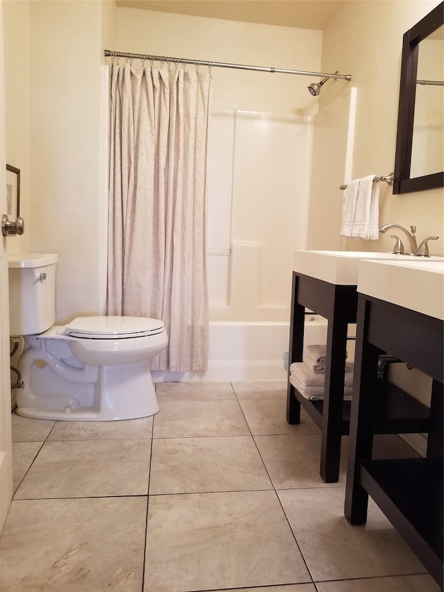 bathroom featuring toilet, tile patterned flooring, shower / tub combo with curtain, and vanity