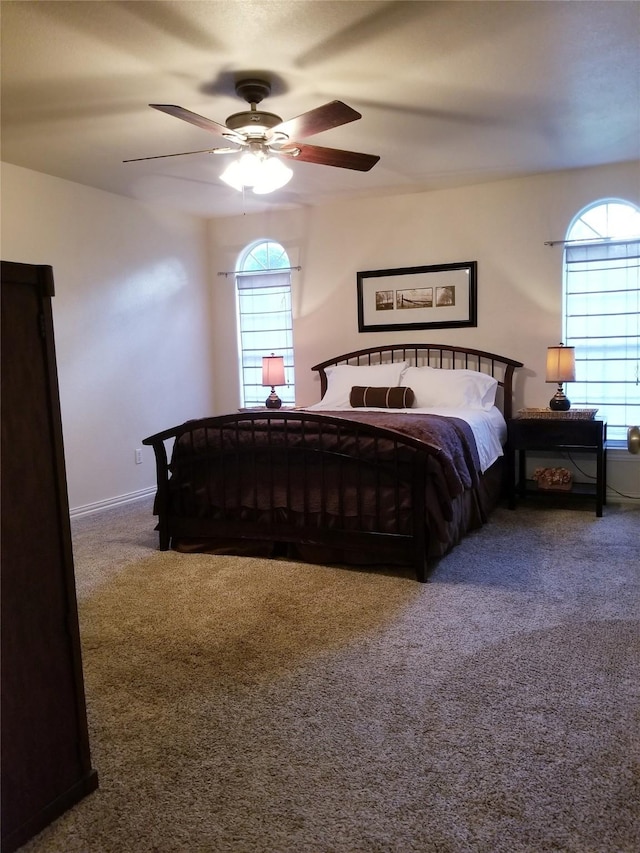 bedroom with carpet floors, ceiling fan, and baseboards