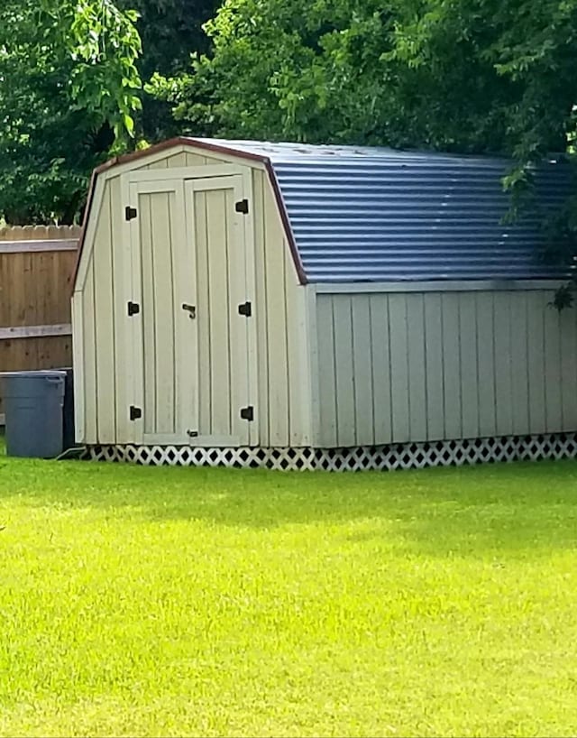 view of shed with fence