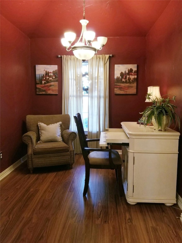 dining space featuring baseboards, a chandelier, and dark wood-type flooring