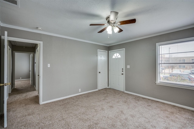 interior space featuring ornamental molding, visible vents, and baseboards